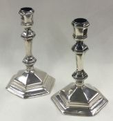 A fine and unusual pair of George I silver octagonal candlesticks. London 1718.