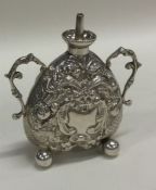 An unusual silver heart shaped table lamp on four
