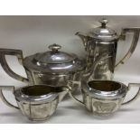 An early 20th Century Chinese export four piece silver tea set engraved with flowers and bamboo.