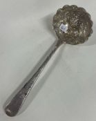 A chased George III silver berry sifter spoon. London 1803.