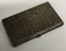 A rare Egyptian silver cigarette case / card holder engraved with hieroglyphics.
