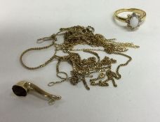 A collection of 9 carat mounted chains and pendants, together with a gilt ring.