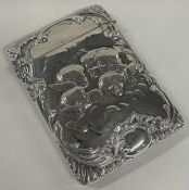A chased silver card case embossed with cherubs. Birmingham 1903.
