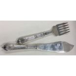 A heavy pair of Victorian silver crested servers. Sheffield 1898. By GH.