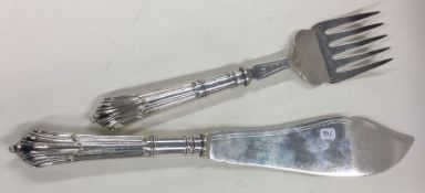 A heavy pair of Victorian silver crested servers. Sheffield 1898. By GH.