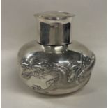 LUEN WO: A heavy Chinese export silver tea caddy embossed with dragons.
