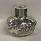 LUEN WO: A heavy Chinese export silver tea caddy embossed with dragons.