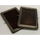 A pair of silver mounted picture frames with panelled backs. Est. £20 - £30.