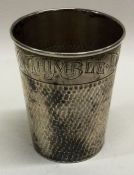 An American silver 'Thimbleful' cup of hammered form.
