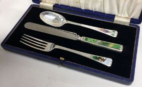 A rare cased 'Humpty Dumpty' silver and enamelled christening set.