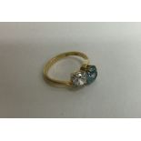 A good 18 carat gold zircon and diamond ring in claw mount. Approx. 4 grams.