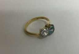 A good 18 carat gold zircon and diamond ring in claw mount. Approx. 4 grams.