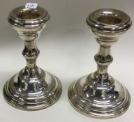 A pair of silver circular candlesticks. Birmingham. Approx. 296 grams gross weight.