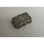 NATHANIEL MILLS: A Victorian silver vinaigrette with engraved decoration.