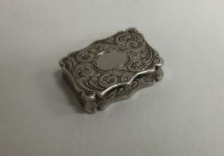 NATHANIEL MILLS: A Victorian silver vinaigrette with engraved decoration.