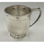 CHESTER: A Glastonbury silver mug of hammered design. 1923. By Barker Brothers.