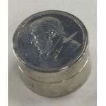 A heavy and fine contemporary silver box with lift-off lid and coin to centre.