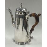 A straight sided George II silver coffee pot with wooden handle. London 1735.