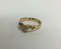 A 14 carat gold diamond four stone ring. Approx. 2 grams