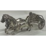 A novelty 19th Century silver model of horses and a carriage. Marked to base.