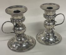 A fine pair of silver chambersticks decorated with an owl to each. London 1857.