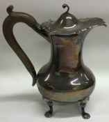 A good Edwardian silver water jug with hinged top.