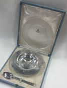 ASPREY & CO: A cased 'Humpty Dumpty' silver christening plate and spoon.
