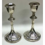 A pair of silver mounted candlesticks. Birmingham. Approx. 397 grams gross weight.