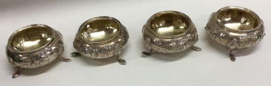A set of four Victorian silver salts with chased decoration. Birmingham.