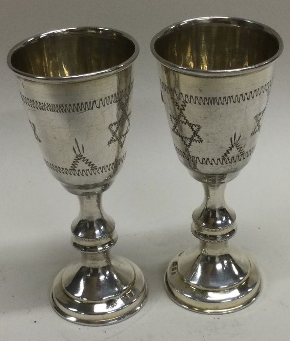 A pair of silver Kiddish cups engraved with the Star of David. London 1925. By Julius Rosenthal.