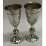 A pair of silver Kiddish cups engraved with the Star of David. London 1925. By Julius Rosenthal.