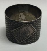 An unusual Russian silver napkin ring with basket weave decoration.