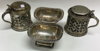 A pair of silver plated mustard pots etc. Est. £10 - £20.