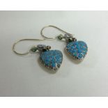 An attractive pair of turquoise and emerald heart shaped earrings with loop top.