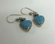 An attractive pair of turquoise and emerald heart shaped earrings with loop top.
