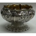 A Georgian silver salt with chased decoration. London. Approx. 81 grams.