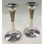 A clean pair of silver and gilt candlesticks. London 1990. By PN. Approx. 265 grams.