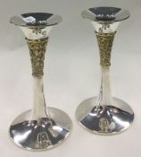A clean pair of silver and gilt candlesticks. London 1990. By PN. Approx. 265 grams.