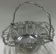 An 18th Century George III silver basket pierced with vines, grapes and butterflies.