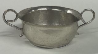 An early 18th Century silver two handled toy porringer. London 1704. By J Cole.