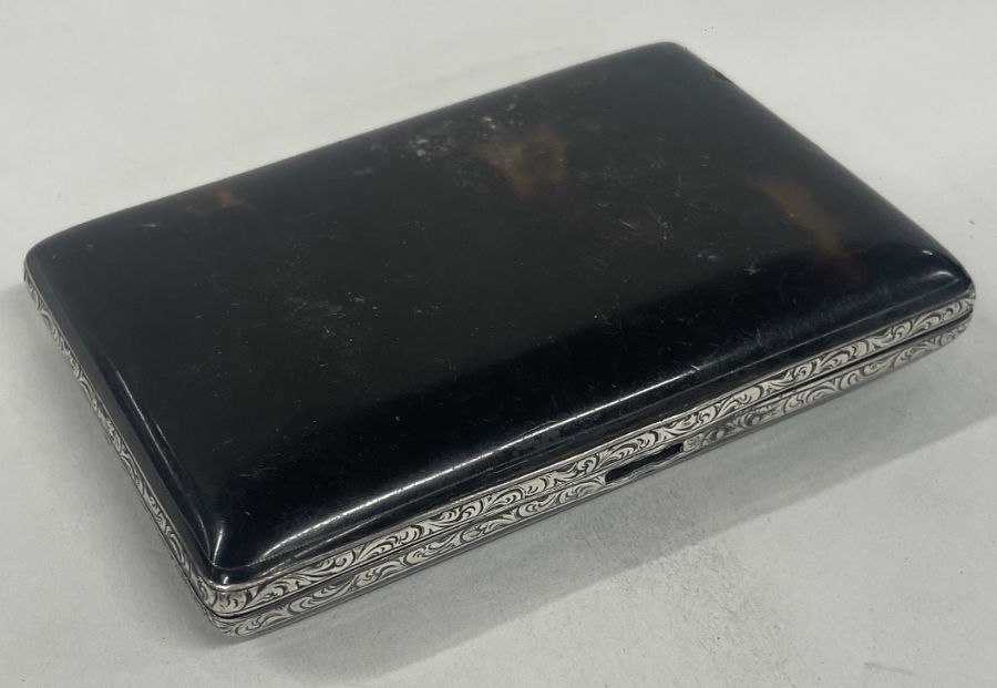 A Victorian silver and tortoiseshell cigarette case. Approx. 85 grams. Est. £40 - £60.