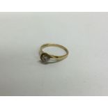 An 18 carat gold diamond single stone ring. Approx. 2 grams