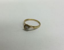 An 18 carat gold diamond single stone ring. Approx. 2 grams