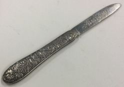An American silver travelling knife with floral chased decoration