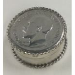 A heavy and fine contemporary silver box with lift-lid and George IV coin to centre.