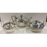 TIFFANY & CO: A 19th Century three piece silver tea service. New York.