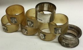A group of six silver and silver mounted horn napkin rings.
