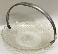 A large silver swing handled cut glass basket. Est. £30 - £40.