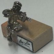 A Judaica silver figure of a man playing violin.