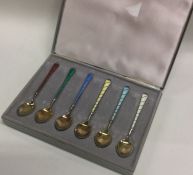 A set of six cased Norwegian silver and enamelled spoons. Approx. 60 grams